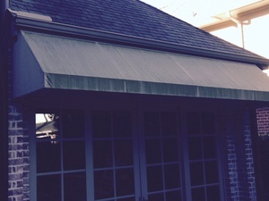 A Houston awning before TruShine cleaning